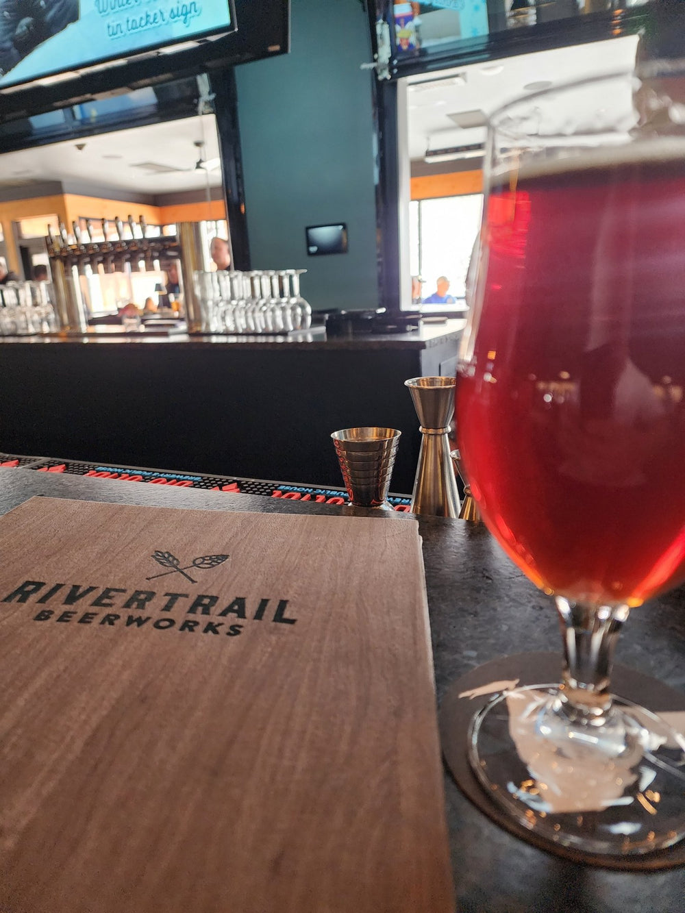 A pour at the Rivertrail Beerworks bar