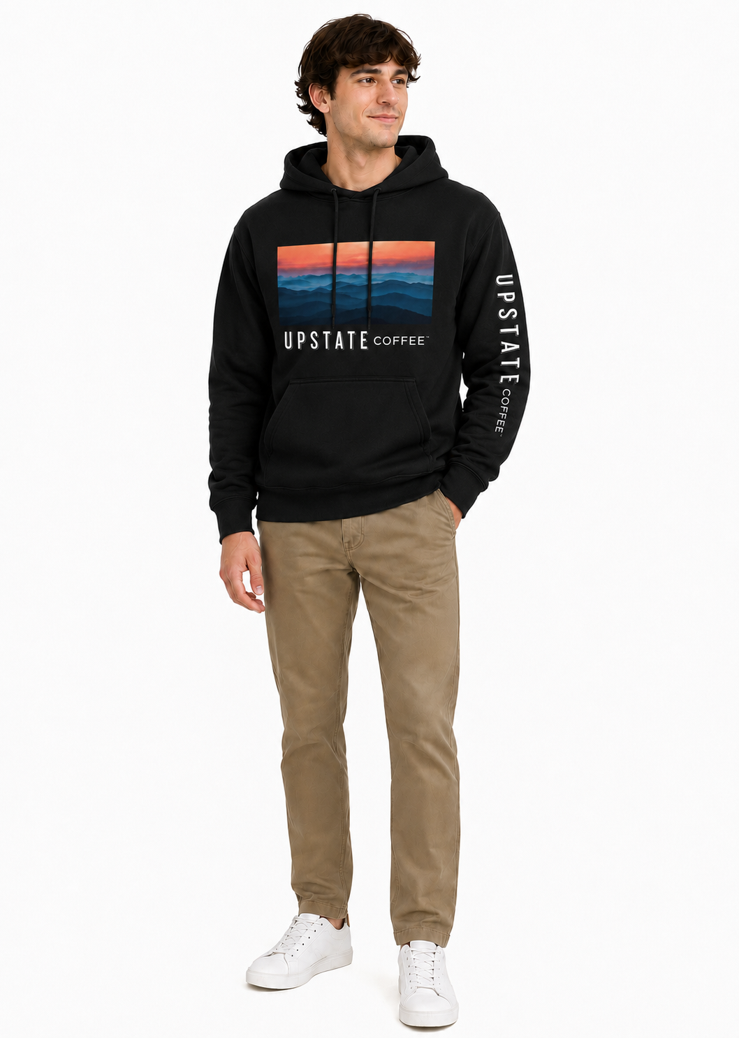 Man wearing a black hoodie with 'Upstate Coffee' mountain scene design on a white background