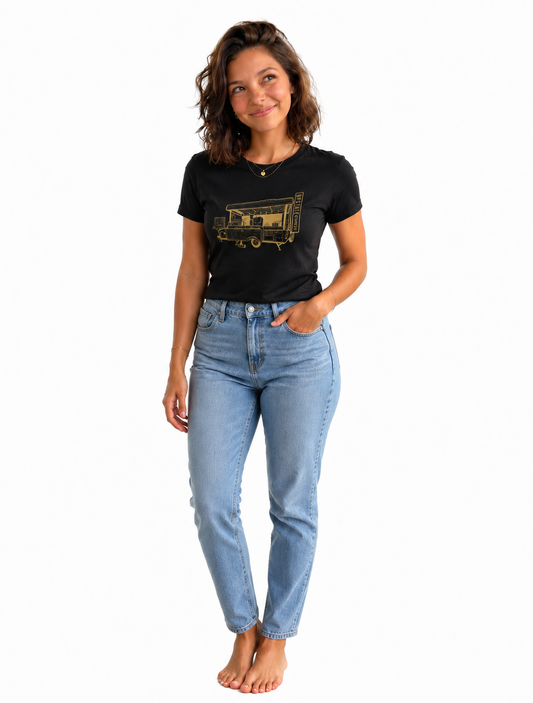 Cute Brunette wearing an Upstate Coffee black t-shirt with a camper graphic design and blue jeans on a white background one hand in pocket