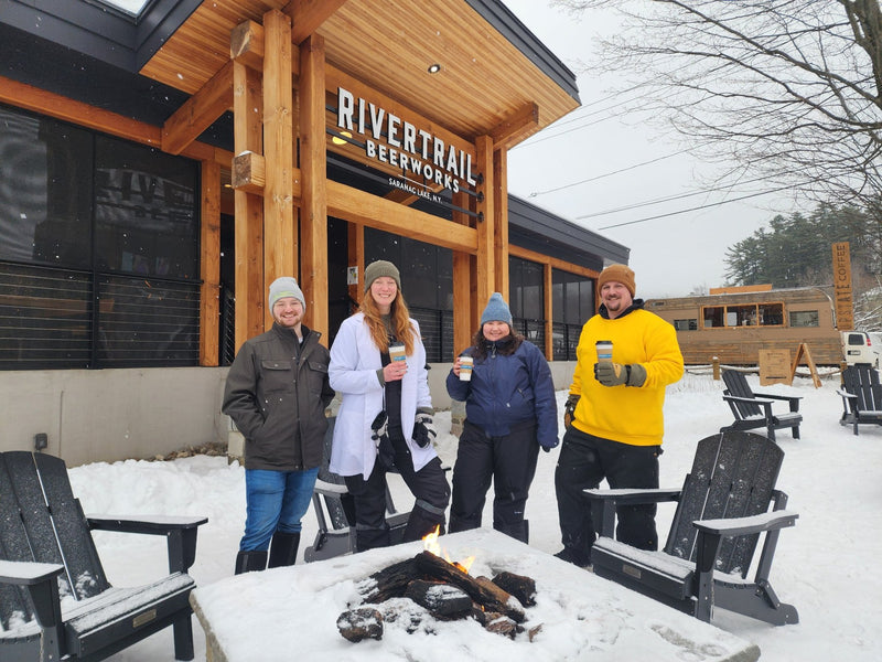 Upstate Coffee and Rivertrail Beerworks by the fire pit outside the brewery in Saranac Lake, with the Upstate Coffee trailer behind